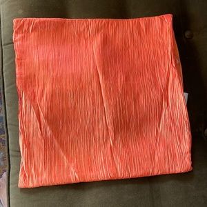 A single orange cushion cover